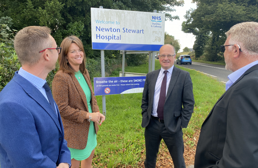 John Cooper standing outside Newton Stewart hospital speaking with three others