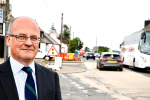 John standing by the A75 at Crocketford