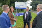 John Cooper standing outside Newton Stewart hospital speaking with three others